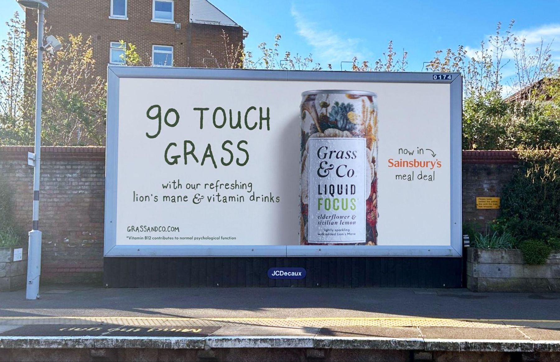Touch Grass campaign billboard